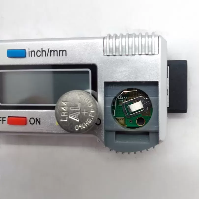 Tire tread depth gauge displays numbers